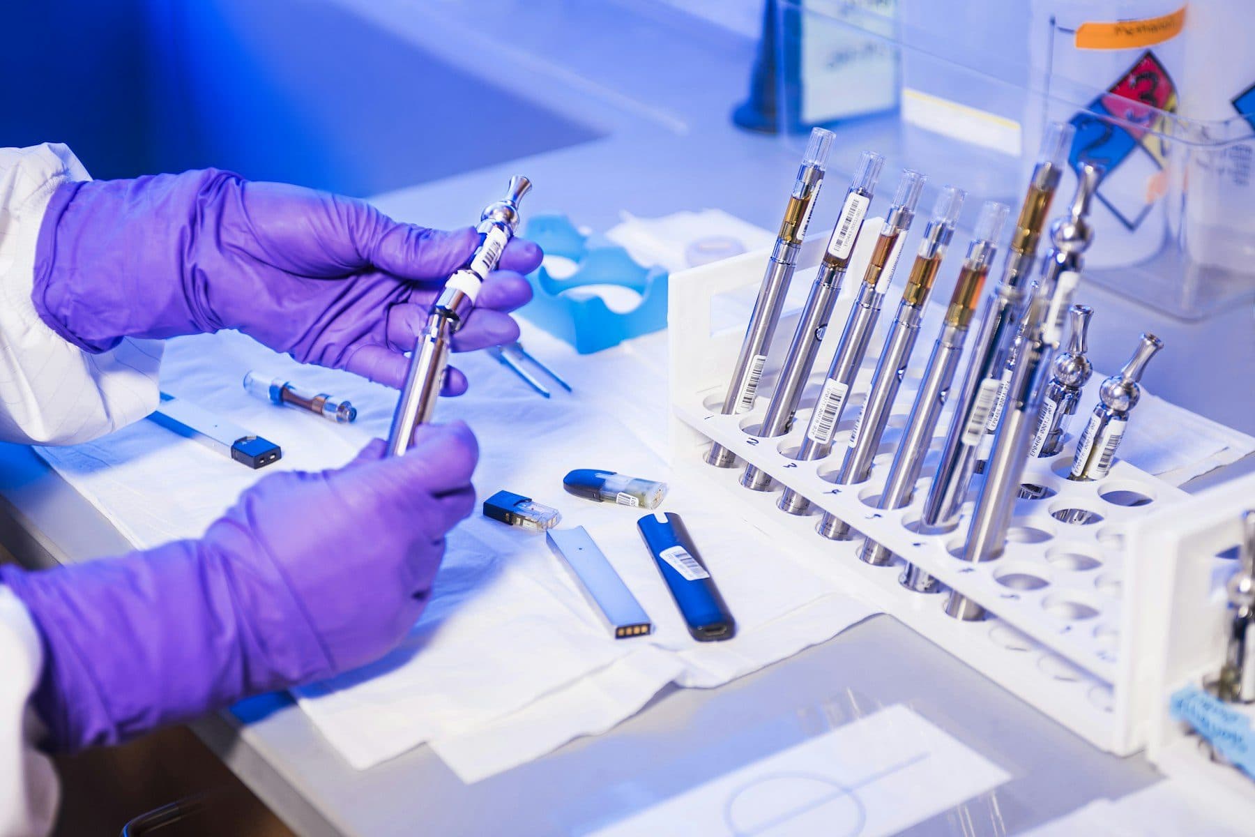 Racks of sample vials under laboratory lighting.